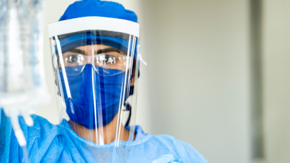 A medical professional in personal protective equipment