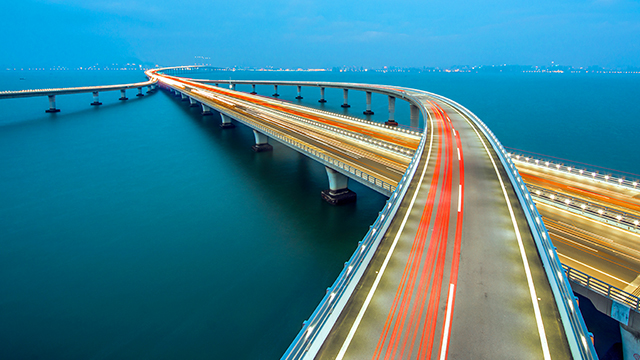 Bridges over water with streaks of light