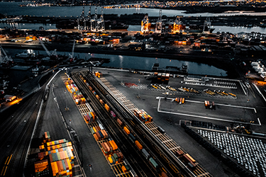 Aerial skyline view of a city and roads at night