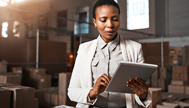 Woman looking at a tablet in an office