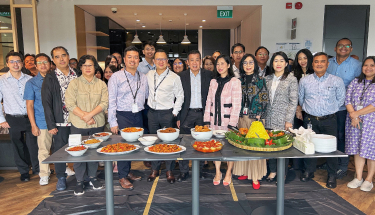 Fighting against hunger: A group of people in front of a dinner table 