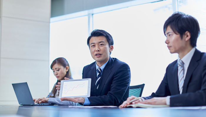 Three people in a meeting