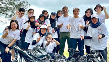 A group of people with garbage bags 