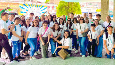 Cultivating children’s creativity: A group of volunteers and students outside