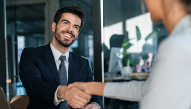 Two business people shaking hands