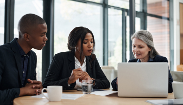 Three people having a business meeting