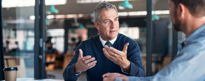 Two men talking in a business setting