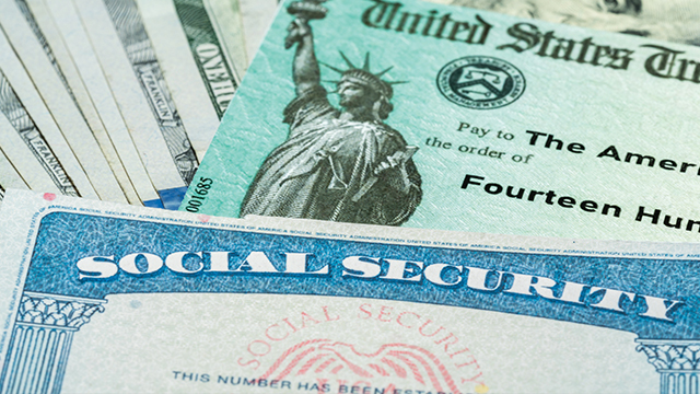 Social security card on top of money